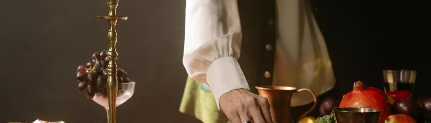 Photo by cottonbro studio: https://www.pexels.com/photo/a-person-in-white-long-sleeves-picking-fruit-from-the-table-8180747/