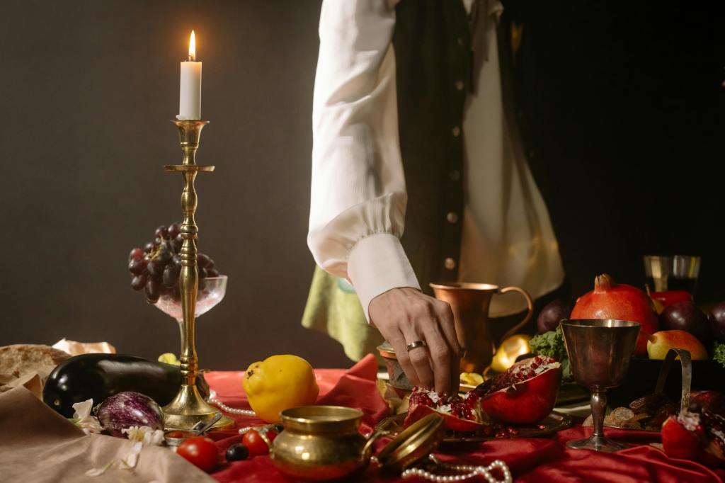 Photo by cottonbro studio: https://www.pexels.com/photo/a-person-in-white-long-sleeves-picking-fruit-from-the-table-8180747/
